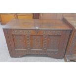 OAK COFFER WITH DECORATIVE CARVING TO FRONT, 17TH CENTURY BY REPUTE.