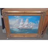 GILT FRAMED PICTURE OF SAILING SHIP AT SEA IN ORNATE GILT FRAME,