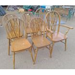 SET OF 6 OAK WHEEL BACK CHAIRS INCLUDING 2 ARMCHAIRS ON TURNED SUPPORTS.