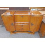 MID 20TH CENTURY WALNUT DRINKS CABINET WITH CENTRAL FALL FRONT & 2 DRAWERS FLANKED BY 2 PANEL DOORS,