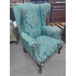 EARLY 20TH CENTURY WINGBACK OPEN ARMCHAIR ON SHORT QUEEN ANNE SUPPORTS