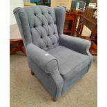 BUTTON WINGBACK ARMCHAIR ON TURNED SUPPORTS.