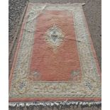 CHINESE RUG WITH PINK & CREAM PATTERN.