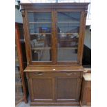 LATE 19TH CENTURY OAK BOOKCASE WITH 2 GLAZED PANEL DOORS OVER BASE OF DRAWER OVER 2 PANEL DOORS