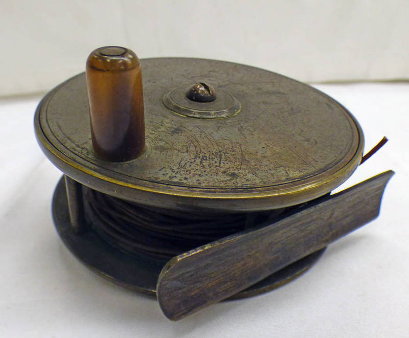 UNMARKED 3 1/2" BRASS REEL WITH SMOOTH FOOT AND LINE