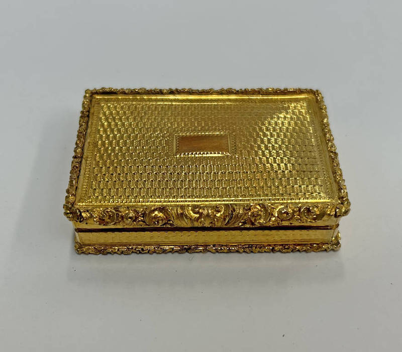 19TH CENTURY CONTINENTAL SILVER GILT SNUFF BOX WITH ENGINE TURNED DECORATION & FOLIATE THUMB PIECE