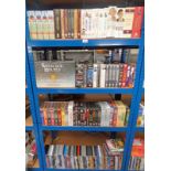 SELECTION OF VARIOUS DVD TITLES OVER FOUR SHELVES