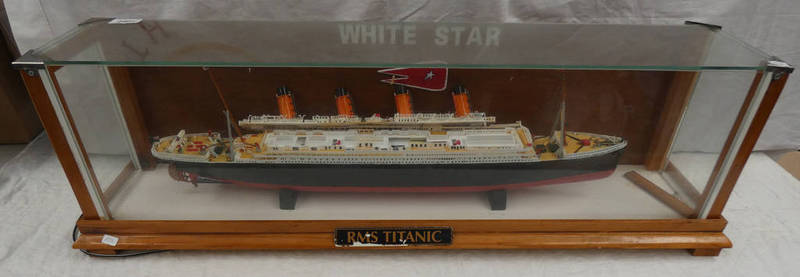 PLASTIC MODEL OF RMS TITANTIC IN DISPLAY CASE.