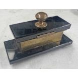EARLY 20TH CENTURY BRASS & BLACK HARDSTONE DESKTOP STAMP HOLDER WITH FITTED INTERIOR,