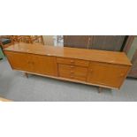 SCANDART TEAK SIDEBOARD OF 4 DRAWERS & 3 PANEL DOORS ON TAPERED SUPPORTS.