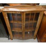 MAHOGANY DISPLAY CABINET WITH SHELVED INTERIOR BEHIND 2 GLASS PANEL DOORS,