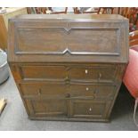 ARTS & CRAFTS OAK BUREAU WITH FALL FRONT OVER 2 DRAWERS & 2 PANEL DOORS.
