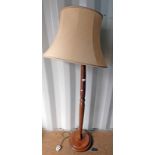 MAHOGANY STANDARD LAMP WITH TURNED COLUMN ON CIRCULAR BASE.