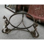 CAST IRON POT STAND WITH DRAGON DECORATION.