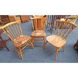 PAIR OF ERCOL BLONDE BEECH SPINDLE BACK CHAIRS ON TURNED SUPPORTS AND ONE OTHER ERCOL CHAIR