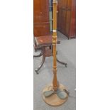 OAK STANDARD LAMP WITH TURNED COLUMN ON CIRCULAR BASE WITH BRASS PROPELLER,