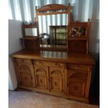 19TH CENTURY OAK MIRROR BACK SIDEBOARD OF 3 DRAWERS OVER 4 PANEL DOORS WITH DECORATIVE CARVING,