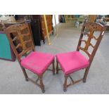 PAIR OF ARTS & CRAFTS STYLE OAK CHAIRS WITH CARVED DECORATION