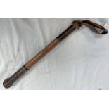 19TH CENTURY LEATHER AND WOOD WEIGHTED BATON WITH LEATHER WRIST STRAP, THE 40.