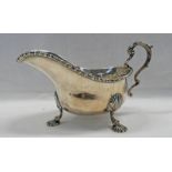 SILVER SAUCE BOAT WITH DECORATIVE RIM & SHELL FEET,