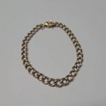 9CT GOLD CURB LINK BRACELET - 21.