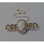 15CT GOLD CAMEO BROOCH WITH CURB LINK MOUNT, MARKED 15CT - 7.