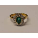 18CT GOLD EMERALD & DIAMOND CLUSTER RING,