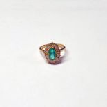 EMERALD & DIAMOND SET CLUSTER RING IN SETTING MARKED 15 CT .