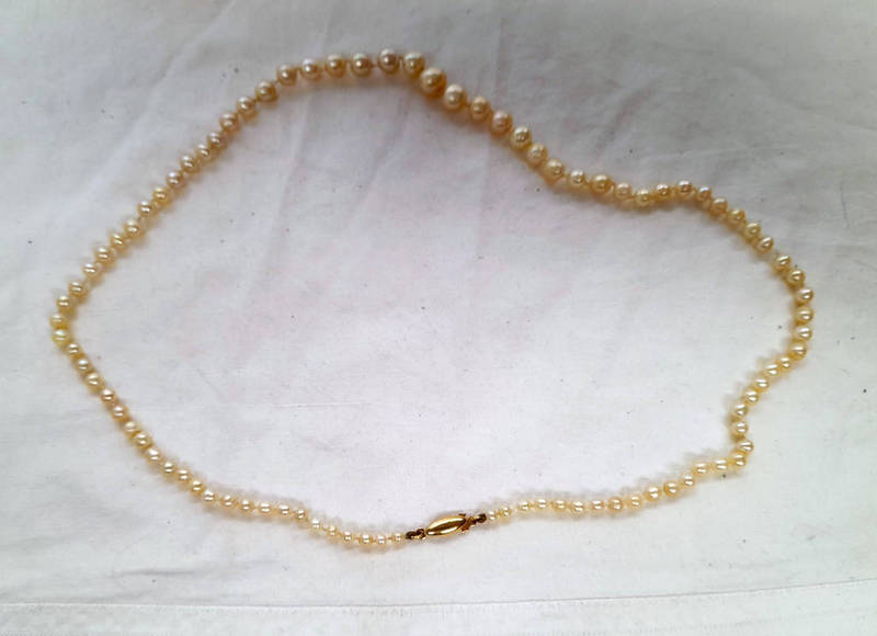 CULTURED PEARL SINGLE STRAND NECKLACE ON AN 18CT GOLD CLASP - 59CM LONG Condition Report: