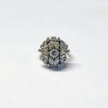 DIAMOND CLUSTER RING, THE CENTRAL BRILLIANT CUT DIAMOND APPROX. 0.