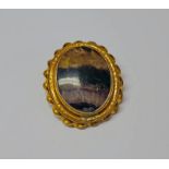 19TH CENTURY BLUE JOHN BROOCH SET IN AN ENGRAVED RIBBON MOUNT - 6CM LONG Condition