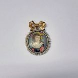 19TH CENTURY OVAL ENAMEL PORTRAIT MINIATURE OF A LADY SET WITHIN A SURROUND OF SEED PEARLS &