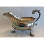 SILVER SAUCE BOAT WITH GADROONED BORDER & SHELL FEET,