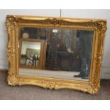 DECORATIVE CARVED GILT FRAMED RECTANGULAR MIRROR.