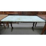 MARBLE TOPPED RECTANGULAR TABLE ON DECORATIVE CAST METAL BASE WITH SHAPED ENDS.