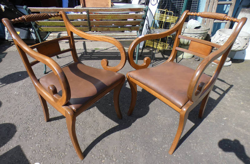 PAIR OF 20TH CENTURY MAHOGANY OPEN ARMCHAIRS ON SABRE SUPPORTS.