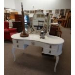 WHITE & GILT DRESSING TABLE WITH 3 PART MIRROR, SHAPED TOP AND 4 DRAWERS ON SHAPED SUPPORTS,