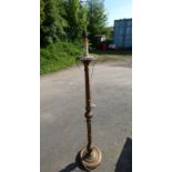 GILT STANDARD LAMP WITH REEDED COLUMN ON CIRCULAR BASE.