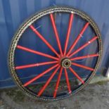 PAINTED WOODEN CART WHEEL WITH GILT DECORATION. SIGNED JOHN STEWART.
