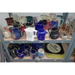 LARGE SELECTION OF WHISKY JUGS , MIRRORS,