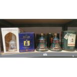 5 BELLS DECANTERS IN BOXES UNOPENED ON ONE SHELF