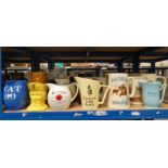 LARGE SELECTION OF WHISKY JUGS ON ONE SHELF