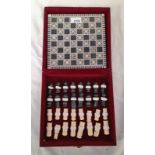 CHESS SET WITH MOTHER OF PEARL INLAID BOARD IN FITTED CASE.