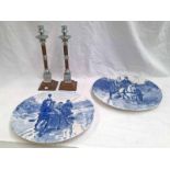 2 LARGE BLUE AND WHITE CIRCULAR PLATES. 39 CMS DIAMETER, 2 ARTS & CRAFTS STYLE CANDLE HOLDERS.