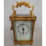 BRASS CARRIAGE CLOCK WITH WHITE DIAL,