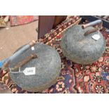 2 CURLING STONES WITH METAL HANDLES