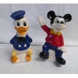 TWO WALT DISNEY PORCELAIN MONEY BANKS FEATURING MICKEY MOUSE AND DONALD DUCK.
