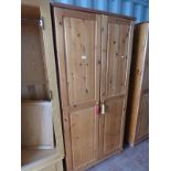 PINE 2 DOOR WARDROBE ON BUN FEET,