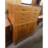 ARTS & CRAFTS STYLE CABINET WITH 8 SHORT DRAWERS OVER 2 DOORS WITH SHELVED INTERIOR .