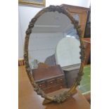 OVAL GILT MIRROR WITH DECORATIVE FRAME ON STAND